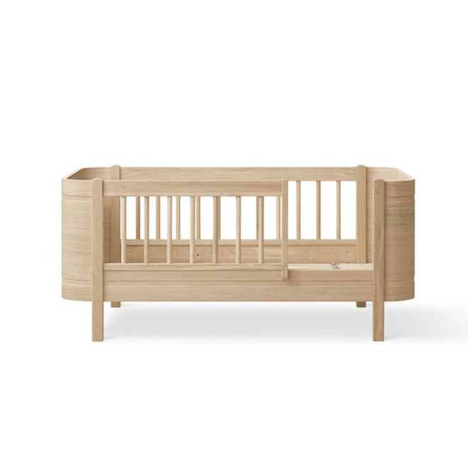 Wood Mini+ Cot Bed Incl. Junior Kit (0-9yrs) - Oak