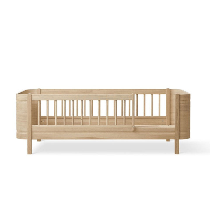 Wood Mini+ Cot Bed Incl. Junior Kit (0-9yrs) - Oak